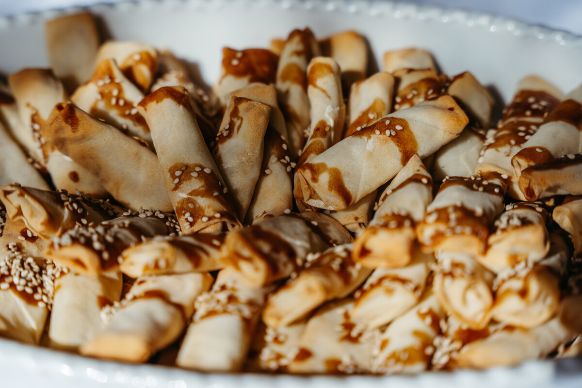 Sliced vegan wraps with toasted seeds and sauce