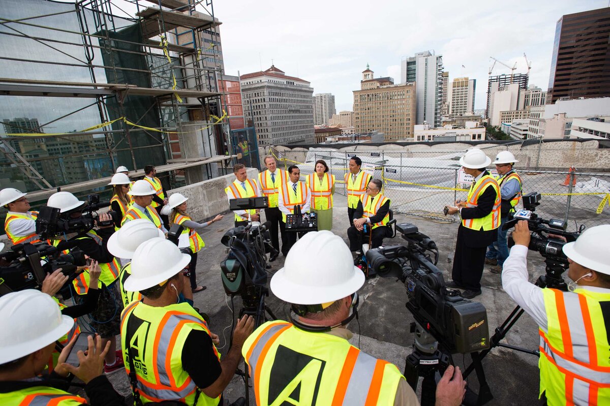 Hud Secretary speaks to reporters at construction site