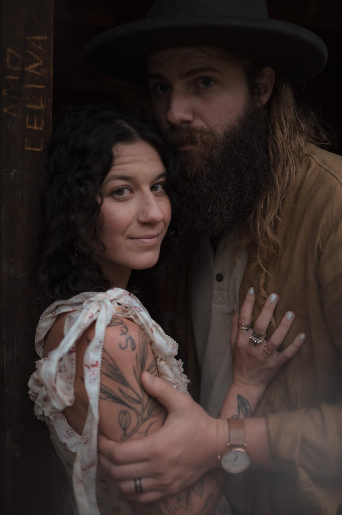 Moody indoor couple photo edited with First Light Collection – rich shadows, warm skin tones, and a cinematic, story-driven look.