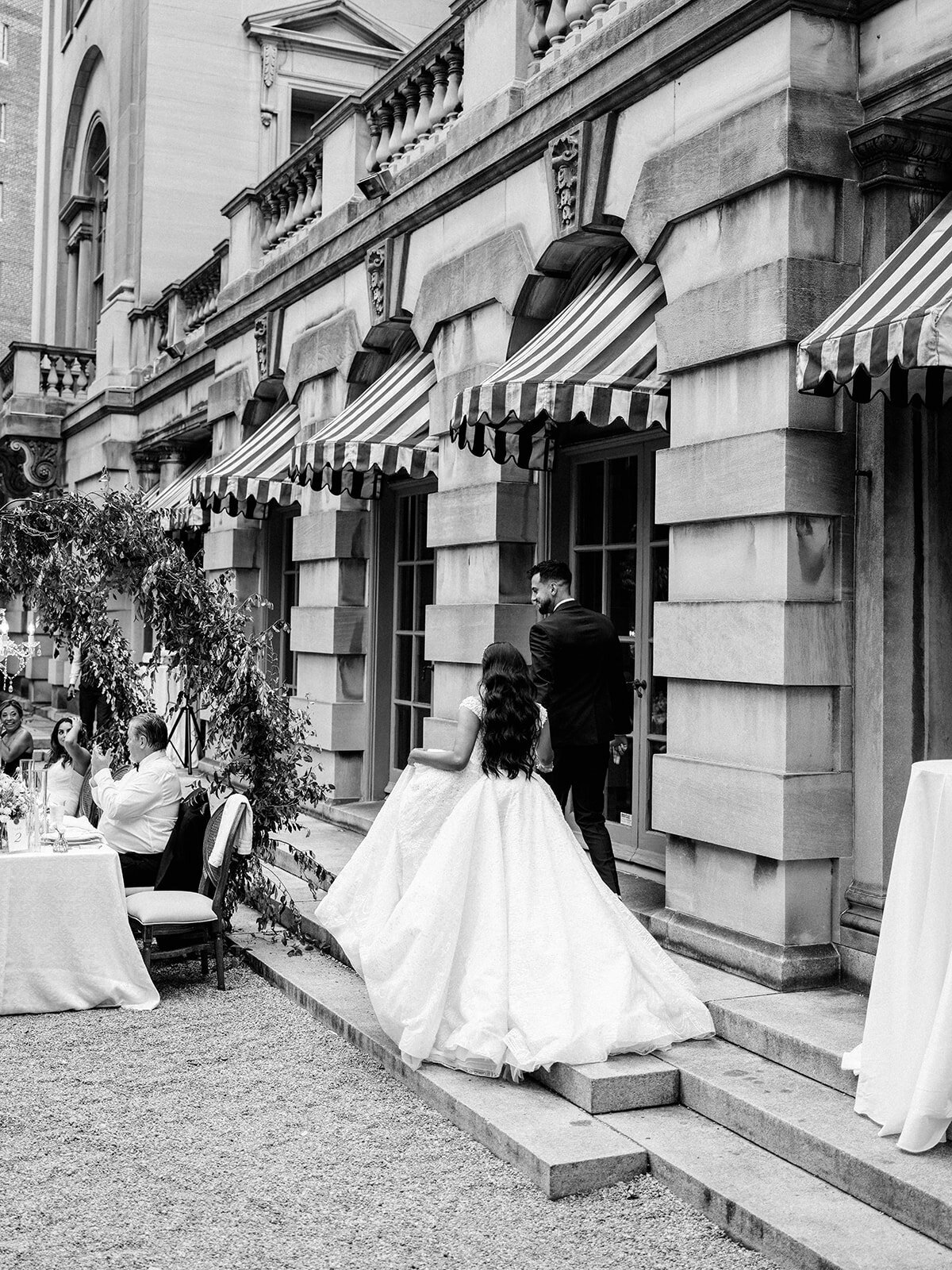 Bride and groom enter reception at their wedding  in Larz Anderson