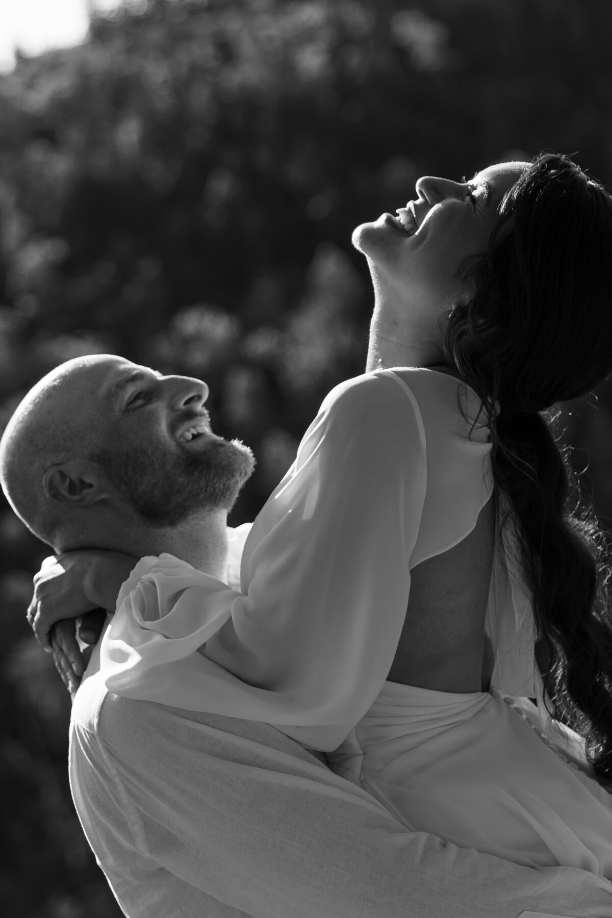 Black and White Photo of Groom Holding Bride in Honolulu, Oahu, Hawaii