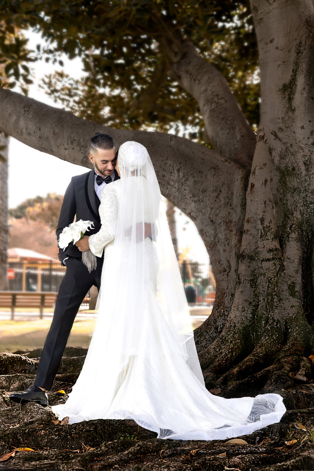 Bride & Groom Back View – Emotional Wedding Moment Beneath Tree in LA