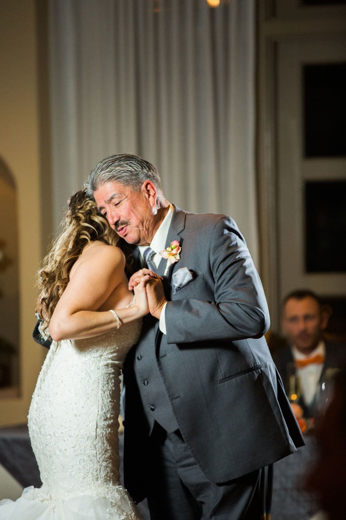 Father of the Bride dances with his daughter at her wedding