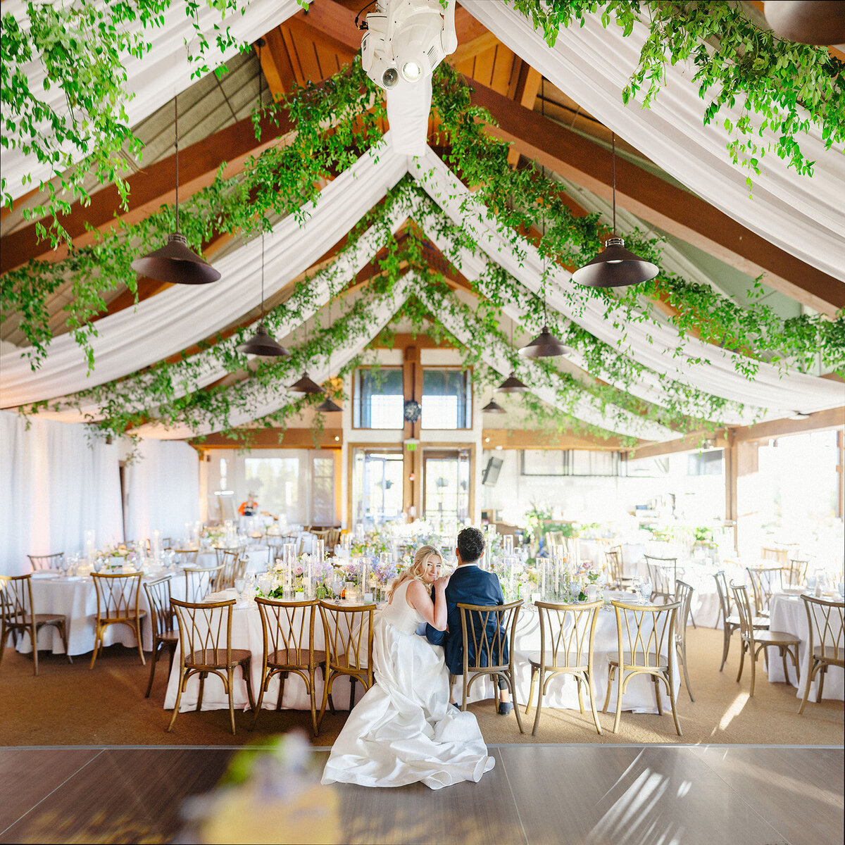 newlyweds-taking-in-the-room-ceiling-treatment-aspen-HBICWeddings