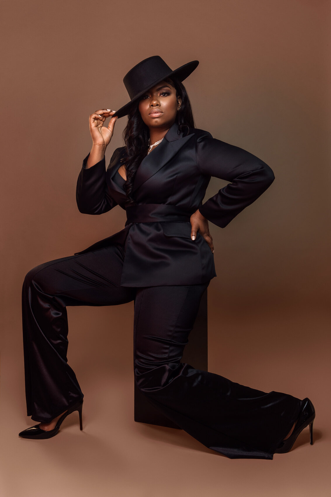 Professional portrait of Jovanne in a stylish outfit, conveying strength and presence, captured by Ylva Erevall.
