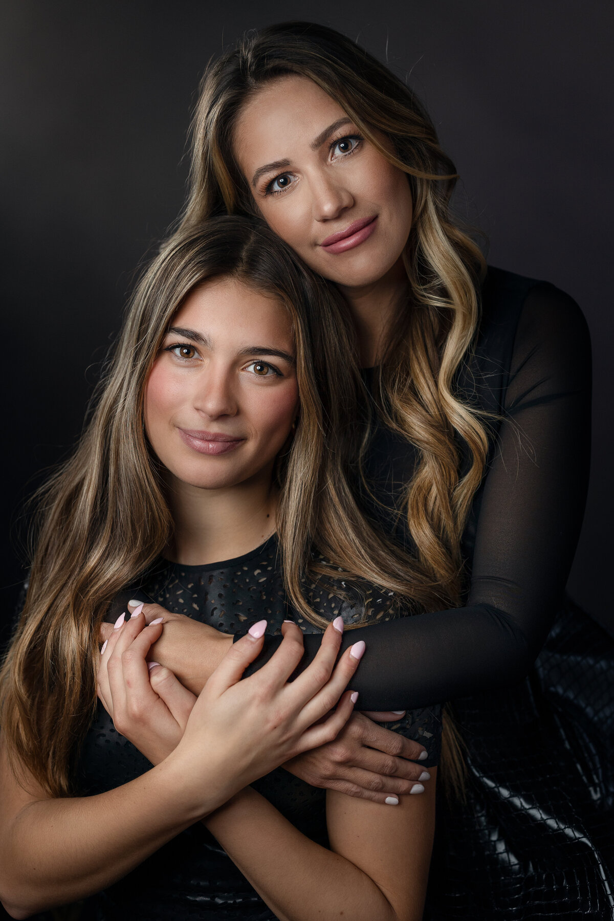 mom and daughter posing for studio portrait in Munster, Indiana