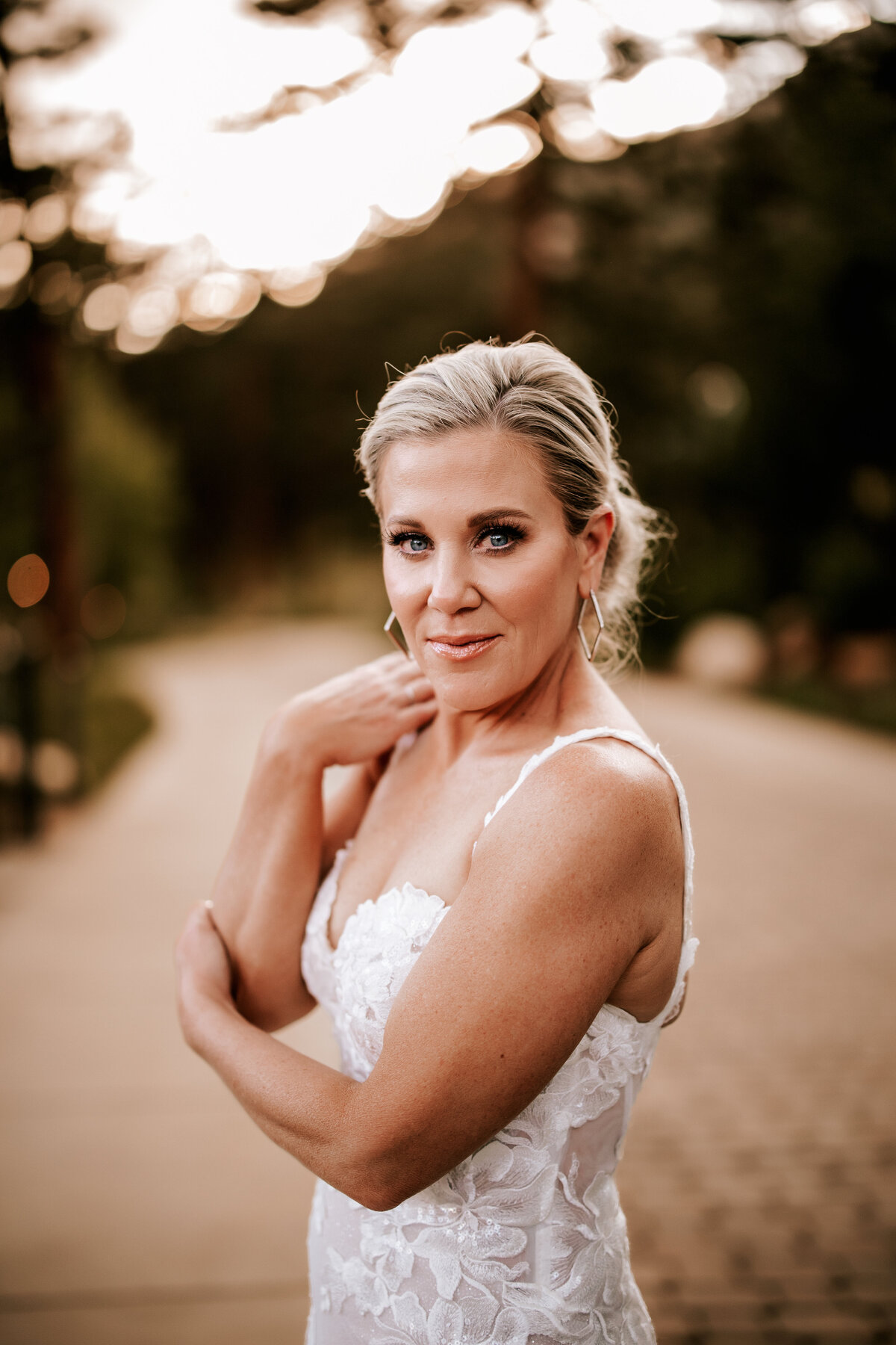 Classic bridal portrait outside of Della Terra with golden hour light shining behind her