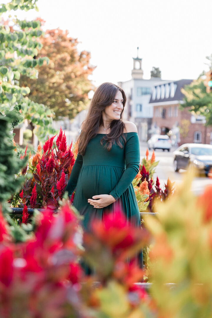 Beautiful expectant mom by fall flowers in Westfield, NJ