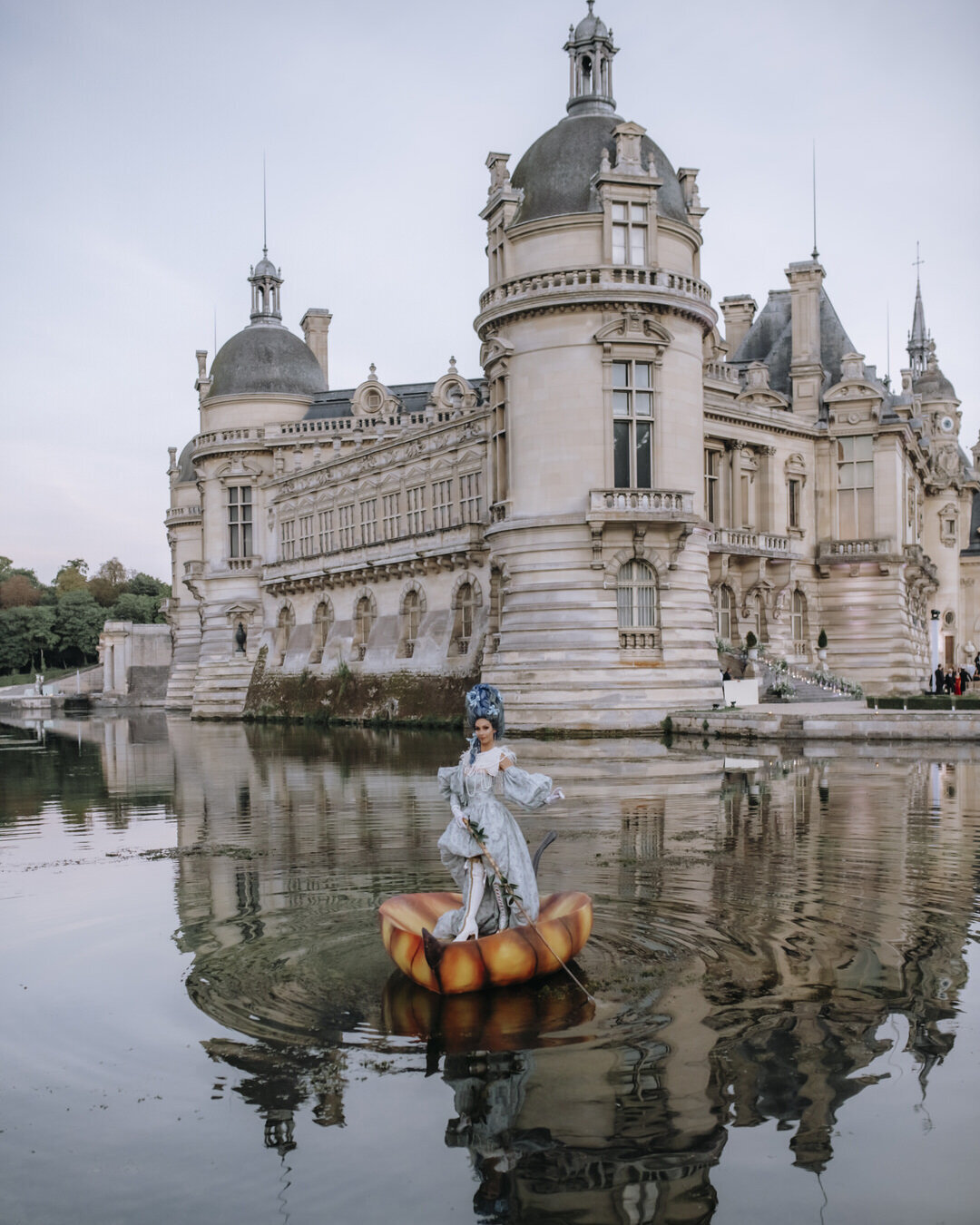 Paris Destination Wedding at Chateau de Chantilly by Alejandra Poupel Events artist on a small boat 