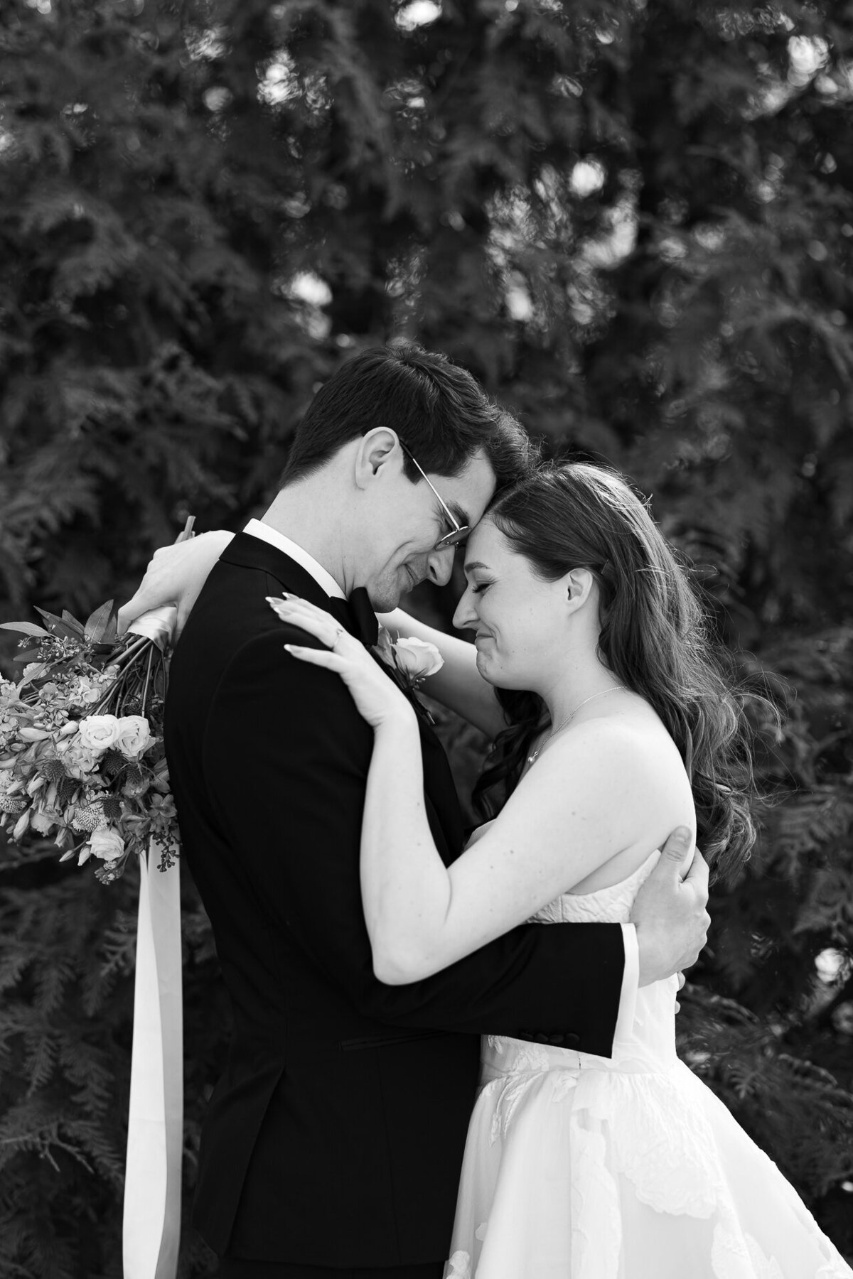 A couple poses on their wedding day at the Garfield Park Conservatory in Chicago