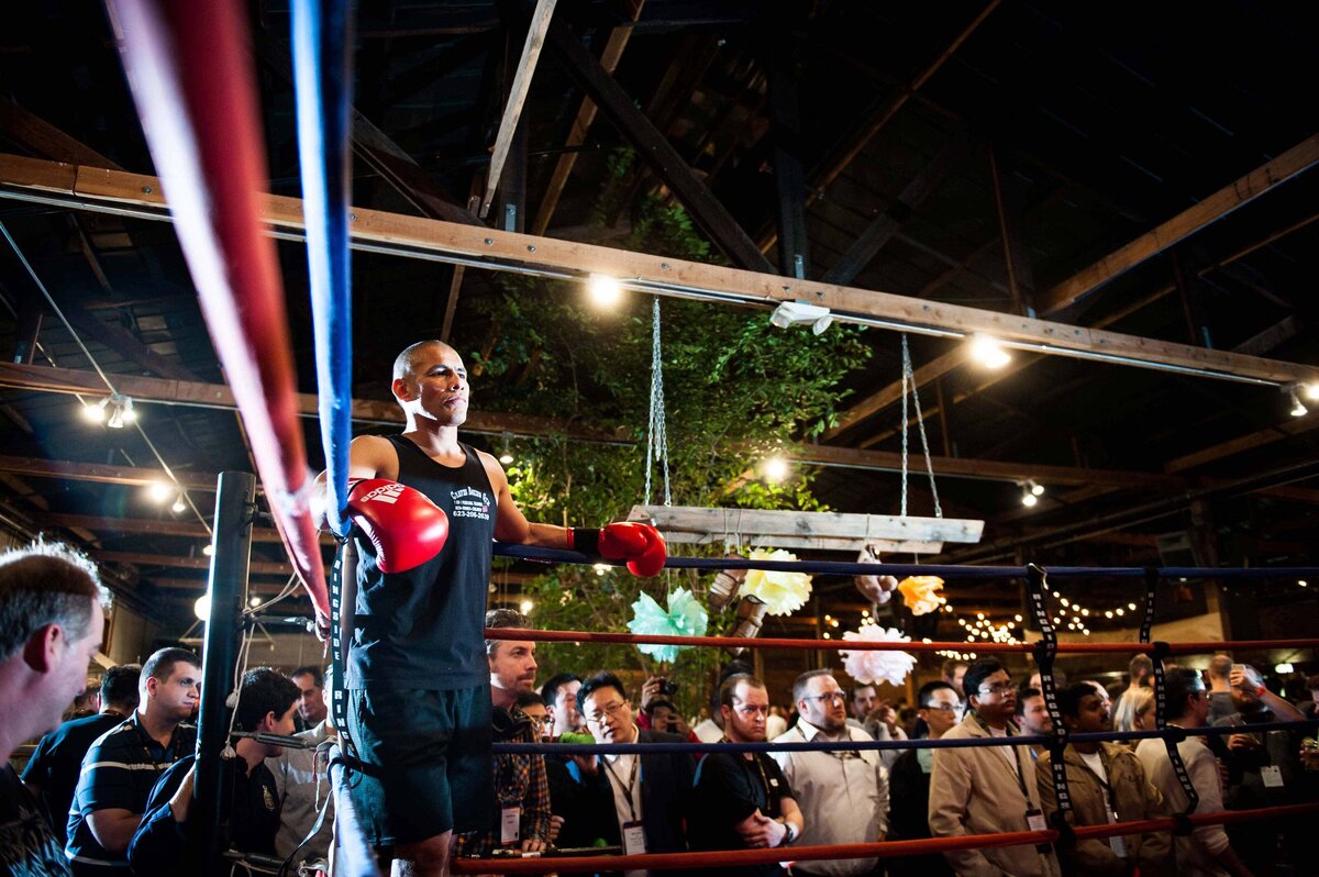 A boxer in the corner of the ring a performance