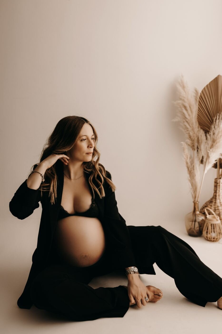 Stylish pregnant woman in a black blazer and lingerie during a maternity photoshoot in Mullingar