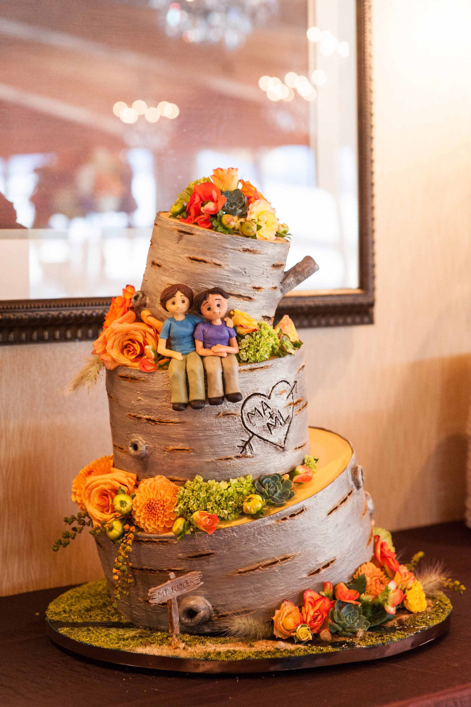 wedding cake with hiking theme, barked style, orange flowers