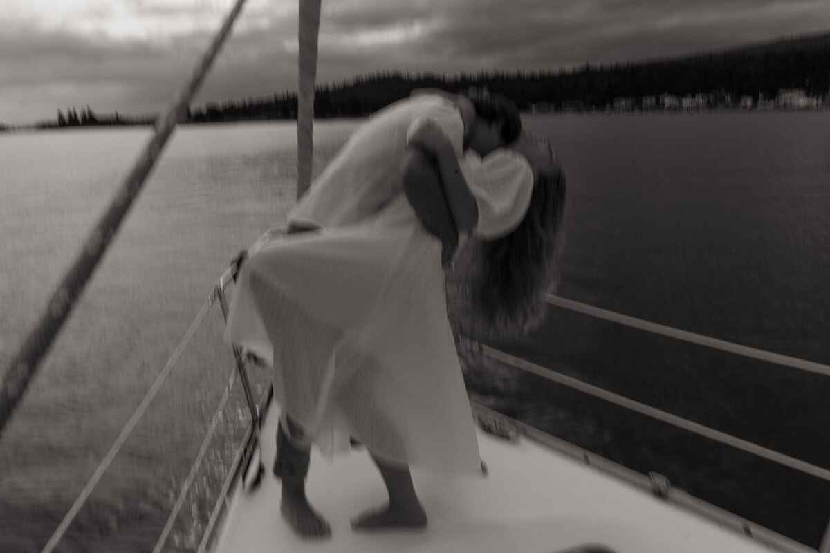 Sailboat Engagement Photoshoot Dipping pose 