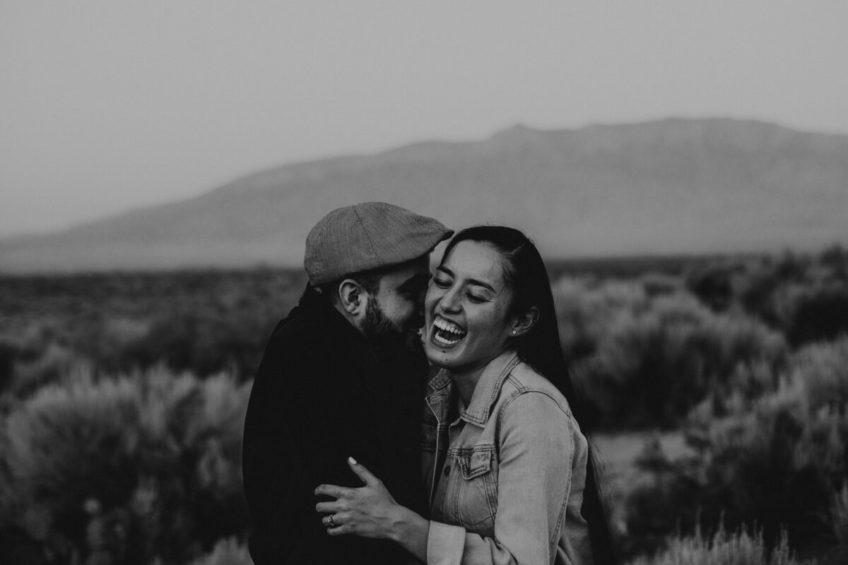 engaged couple laughing in Albuquerque