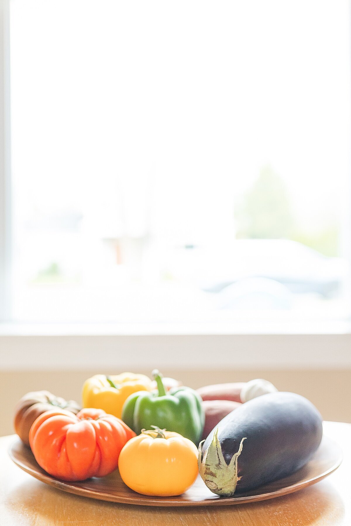 vegetables on plate during BURGEONING BUD POST PARTUM DOULA Branding photo session with Sara Sniderman Photography in Natick Massachusetts