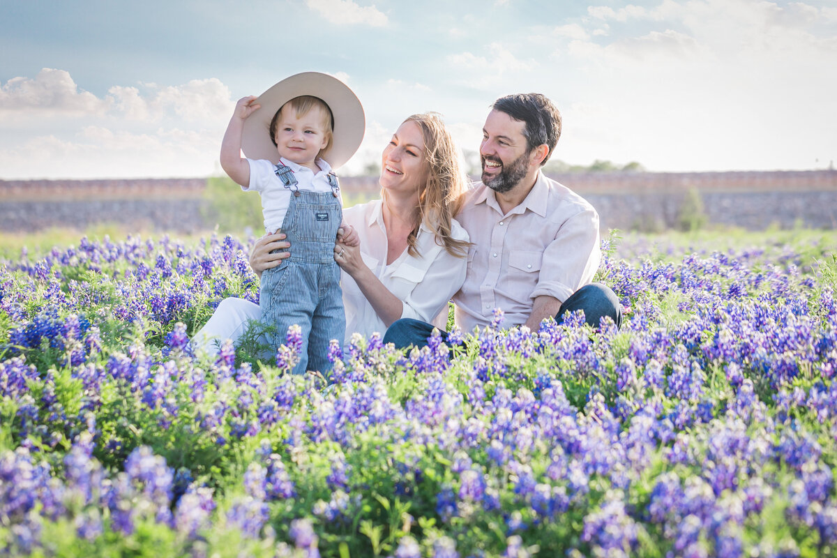 Family in bluebonnets with boy wearing a hat, Austin Family Photographer, Tiffany Chapman Photography