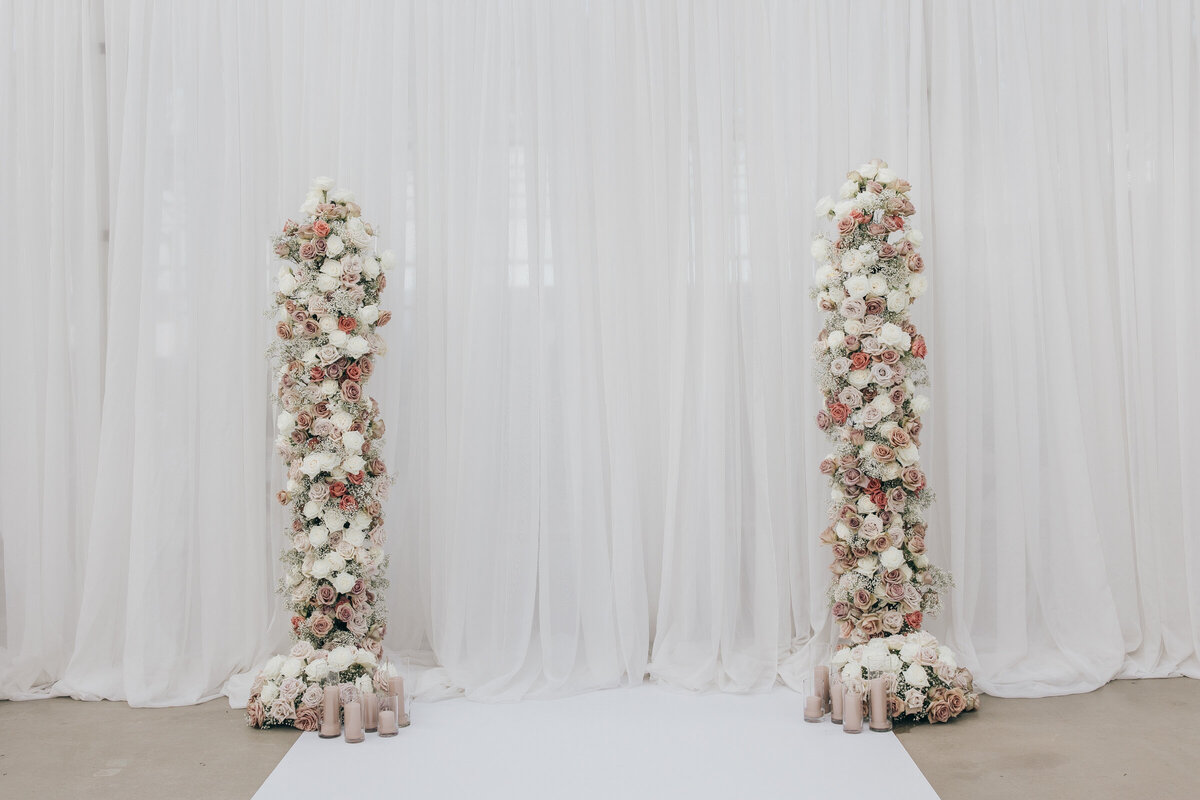 Rose wedding arch with lavender candles at twelfth night events