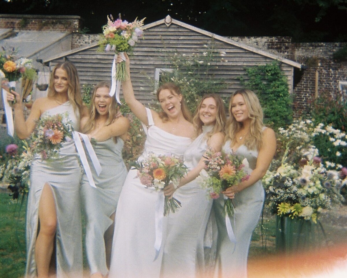 Bride and bridesmaids celebrating a wedding