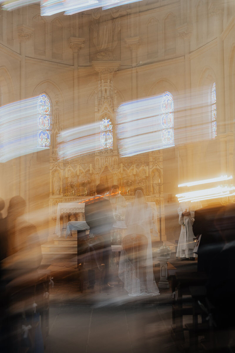 wedding-ceremony-catholic-church-blurry-laurianevega