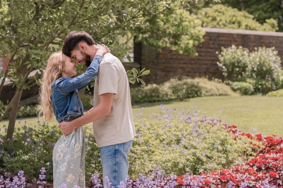 Couple sharing a close moment and smiling during an outdoor session in Pittsburgh — photographed by Pittsburgh Photographer, Bree Stewart of Lens Love Photography.