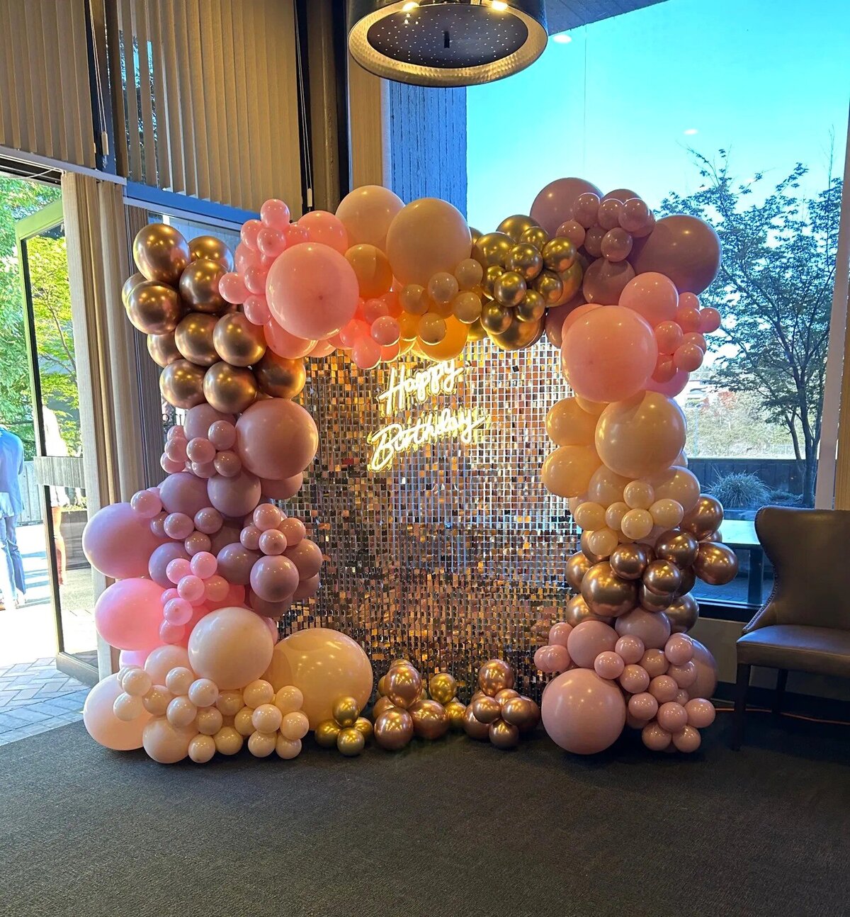 pink and gold birthday balloons with sparkle backdrop