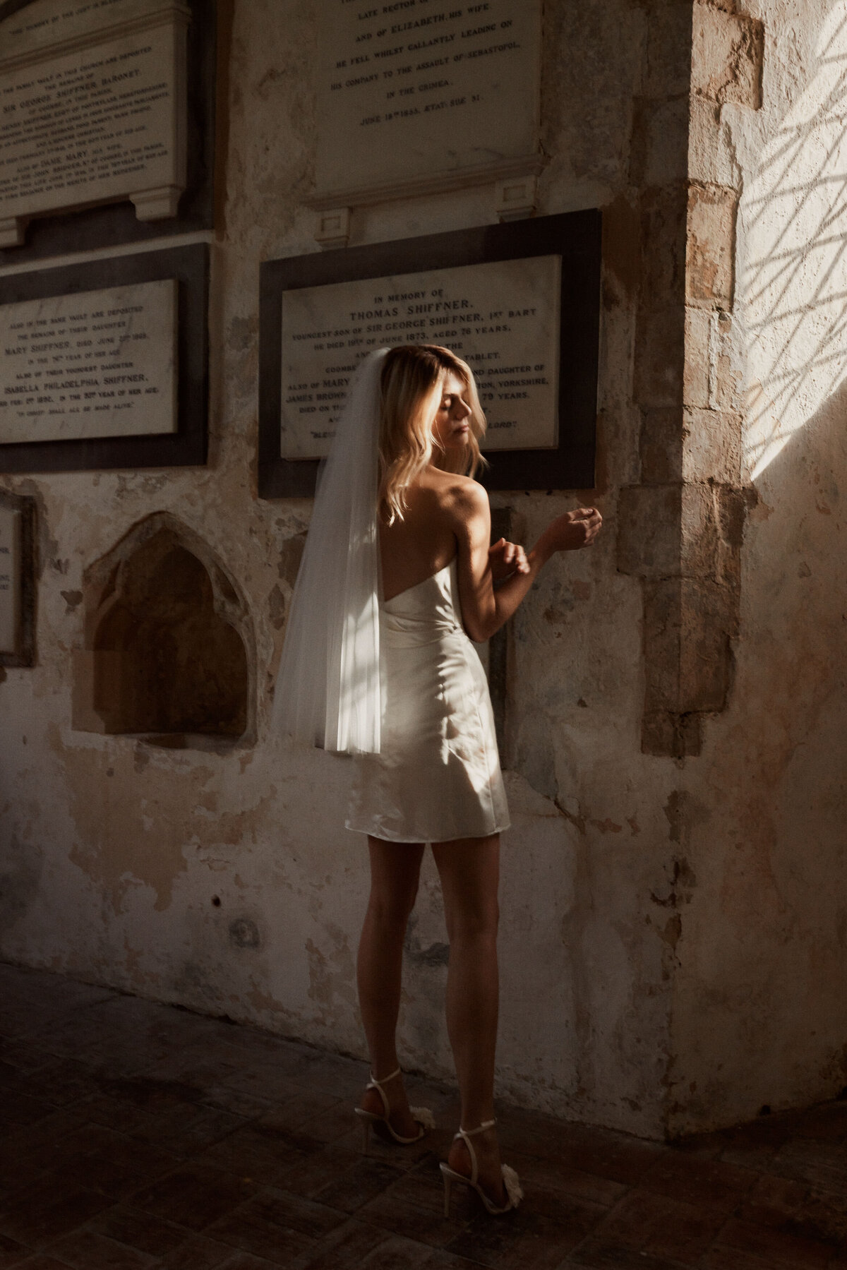 Handmade mini silk wedding dress, corset-style, short dress worn by bride in chapel