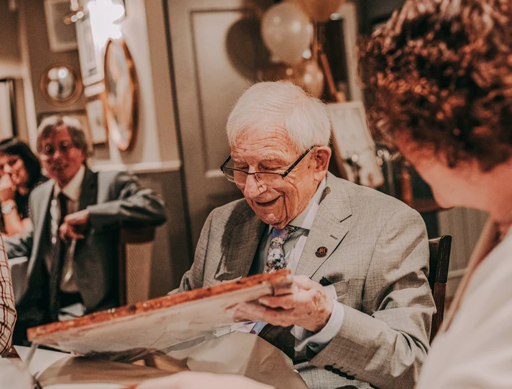 elderly man happy to receive gift