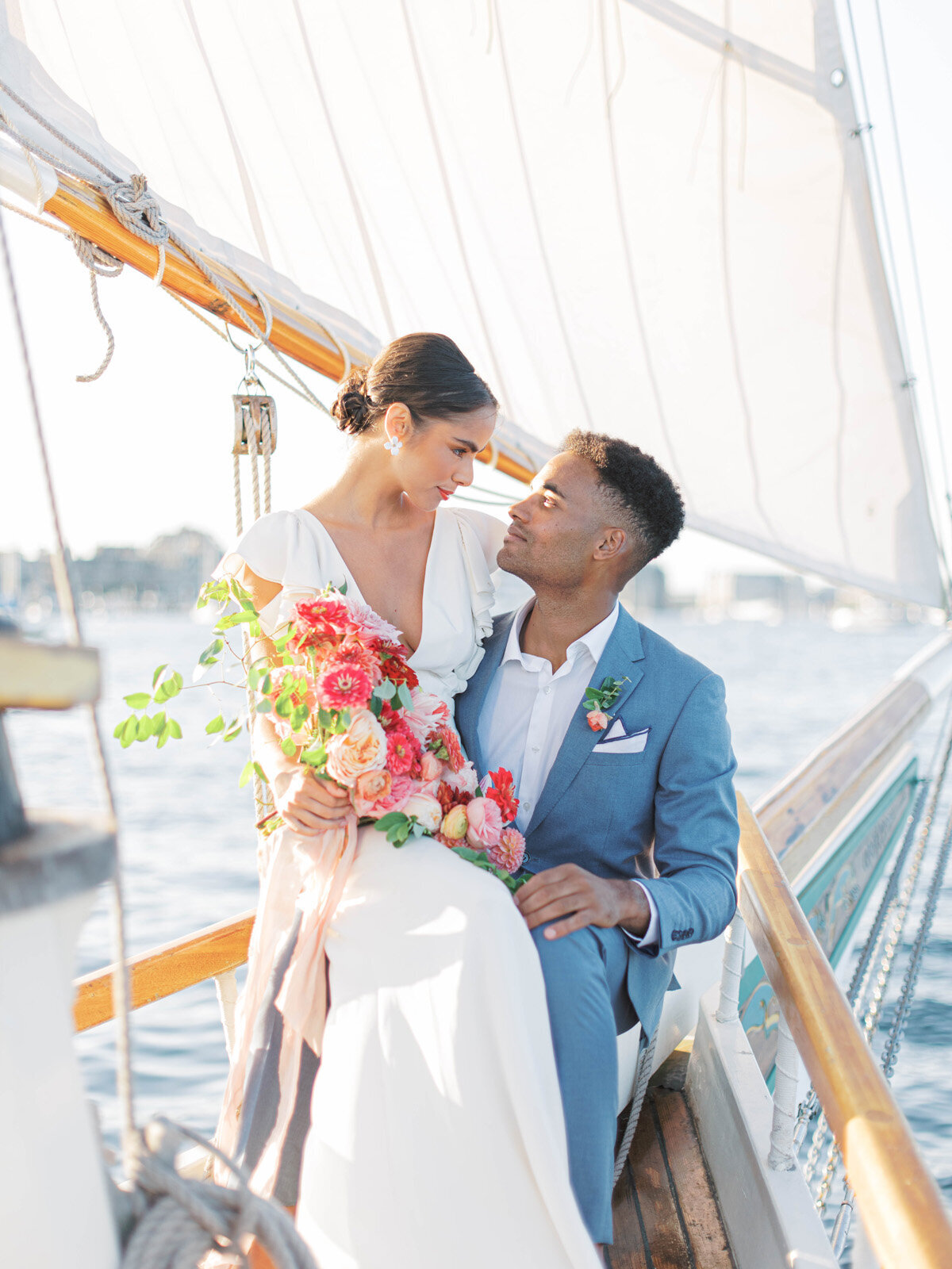 Kate-Murtaugh-Events-elopement-wedding-planner-Boston-Harbor-sailing-sail-boat-yacht-greenery-water-skyline-couple