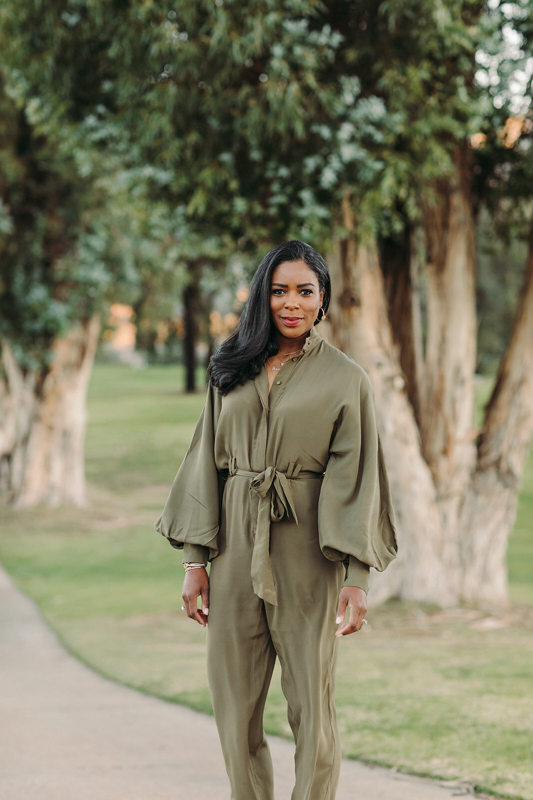Utah Family Photographer captures woman standing in park during brand photography