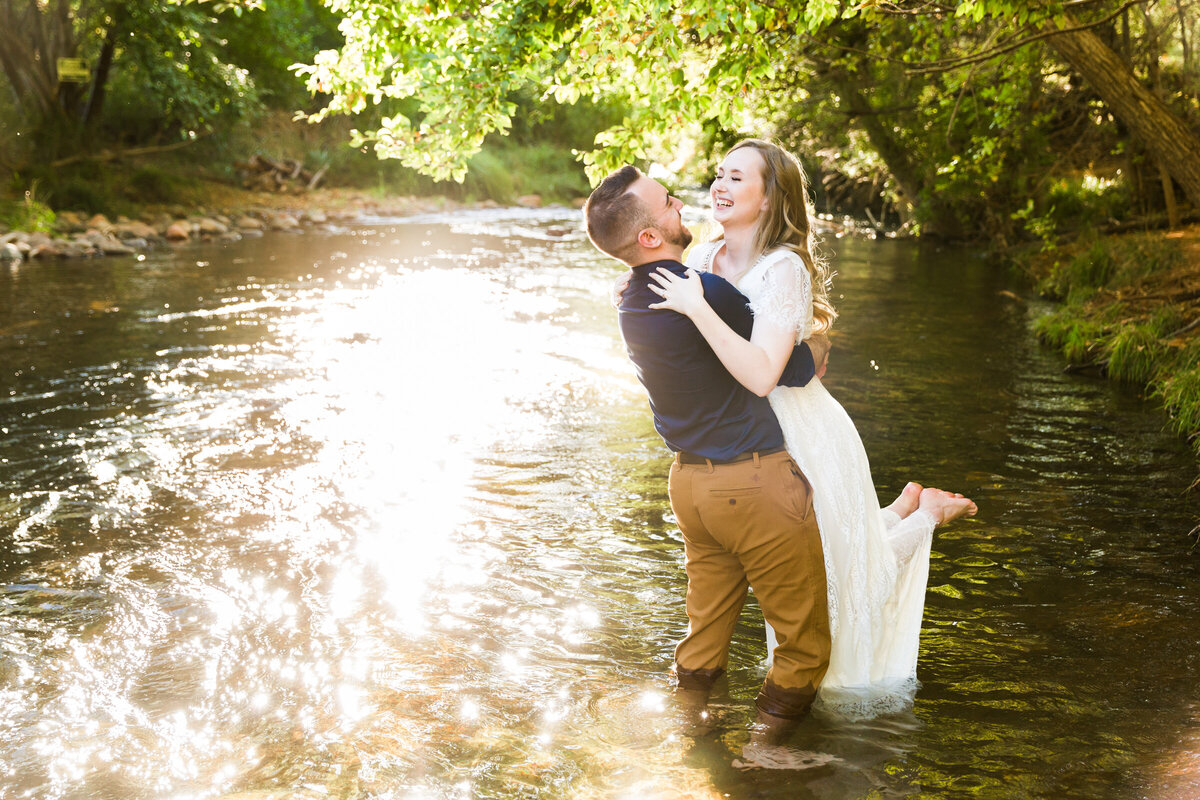 couple hugging in Sedona creek