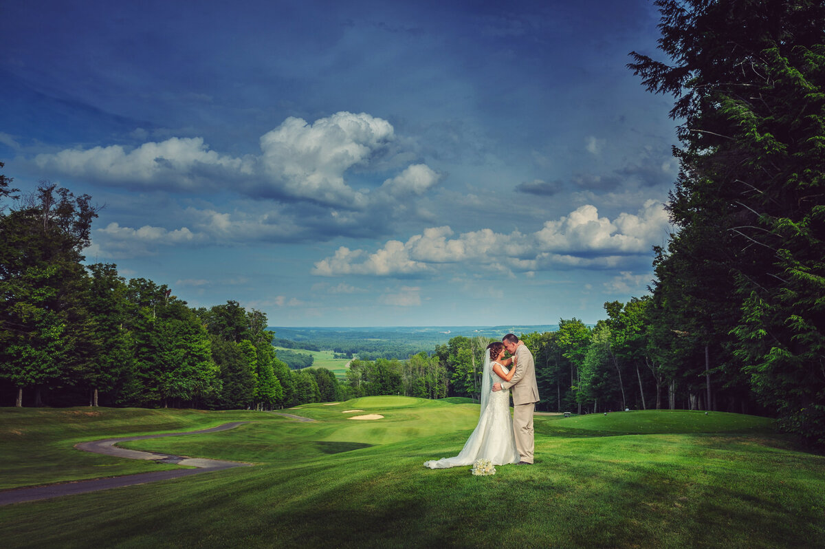 Wedding couple on golf course at Peek'n Peak Resort.