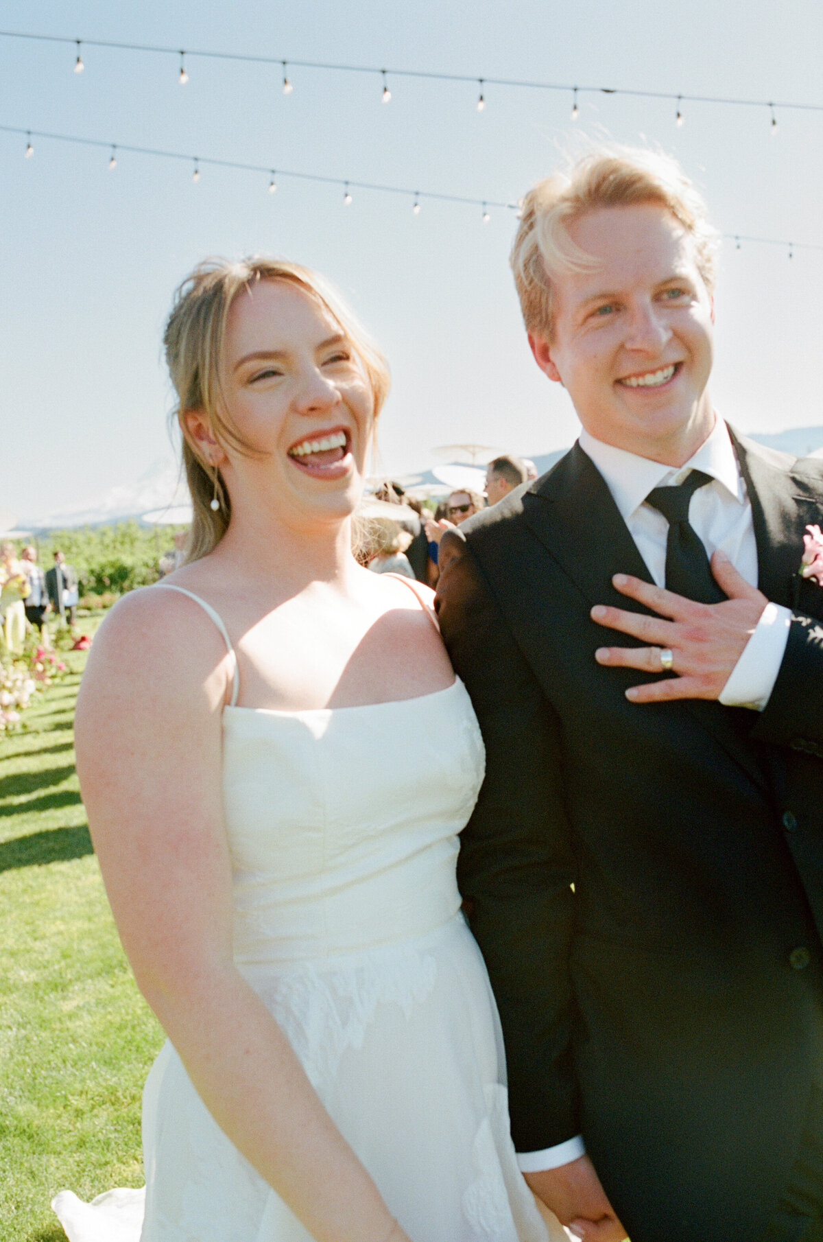 Bride and groom exiting the ceremony with smiles on their face at The Orchard in Hood River.