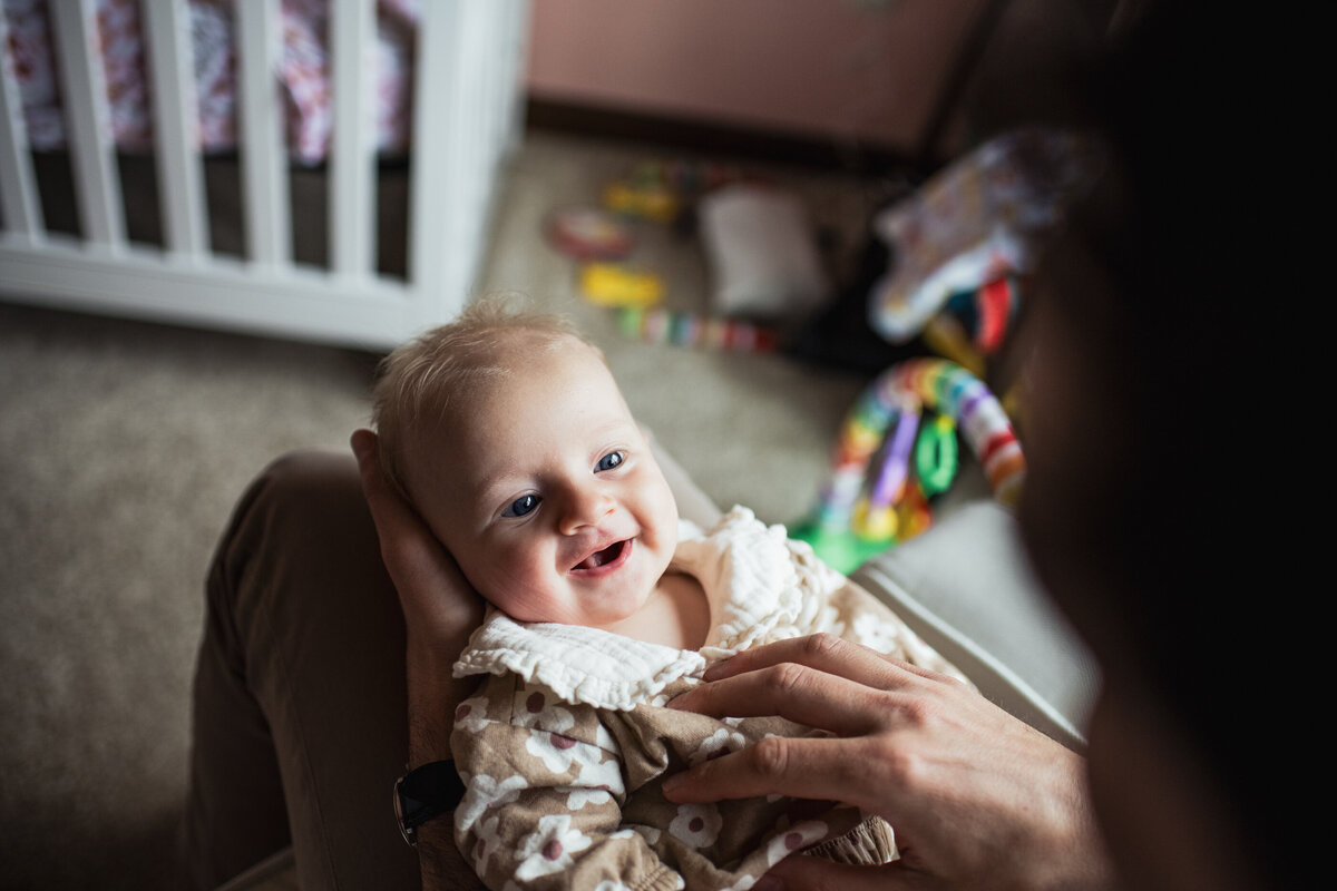 newborn baby photography smiling in cute outfit