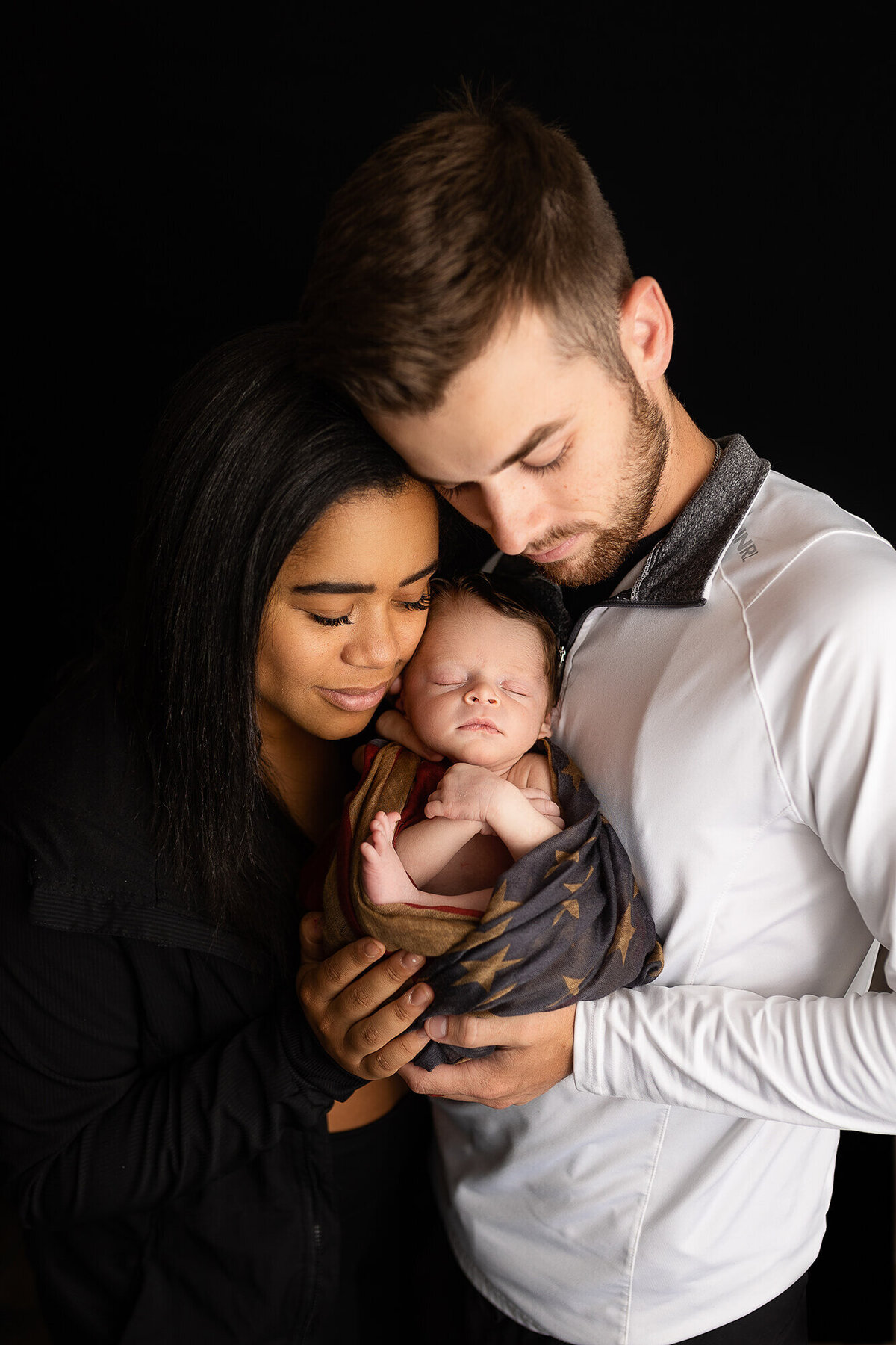 Family portrait with newborn boy.