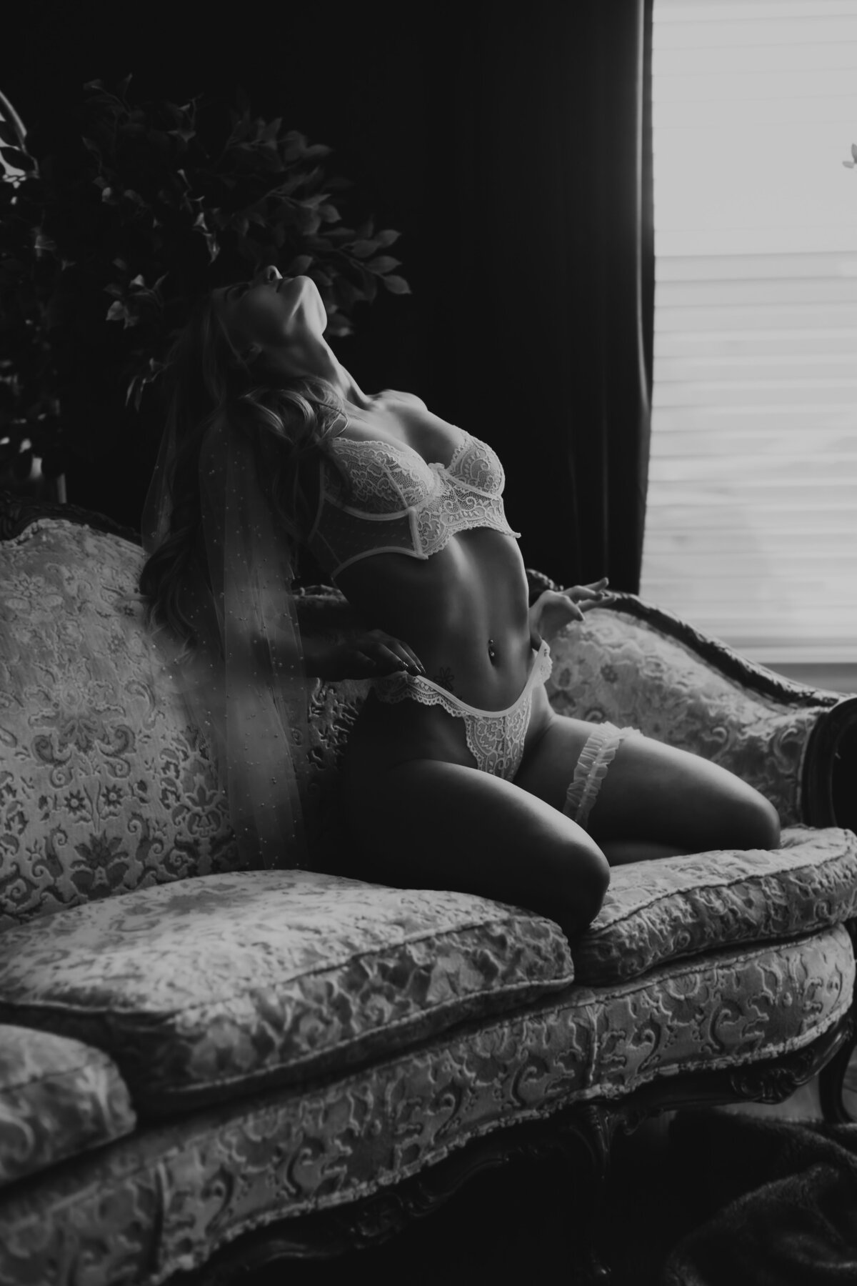 girl leaning back holding on panties