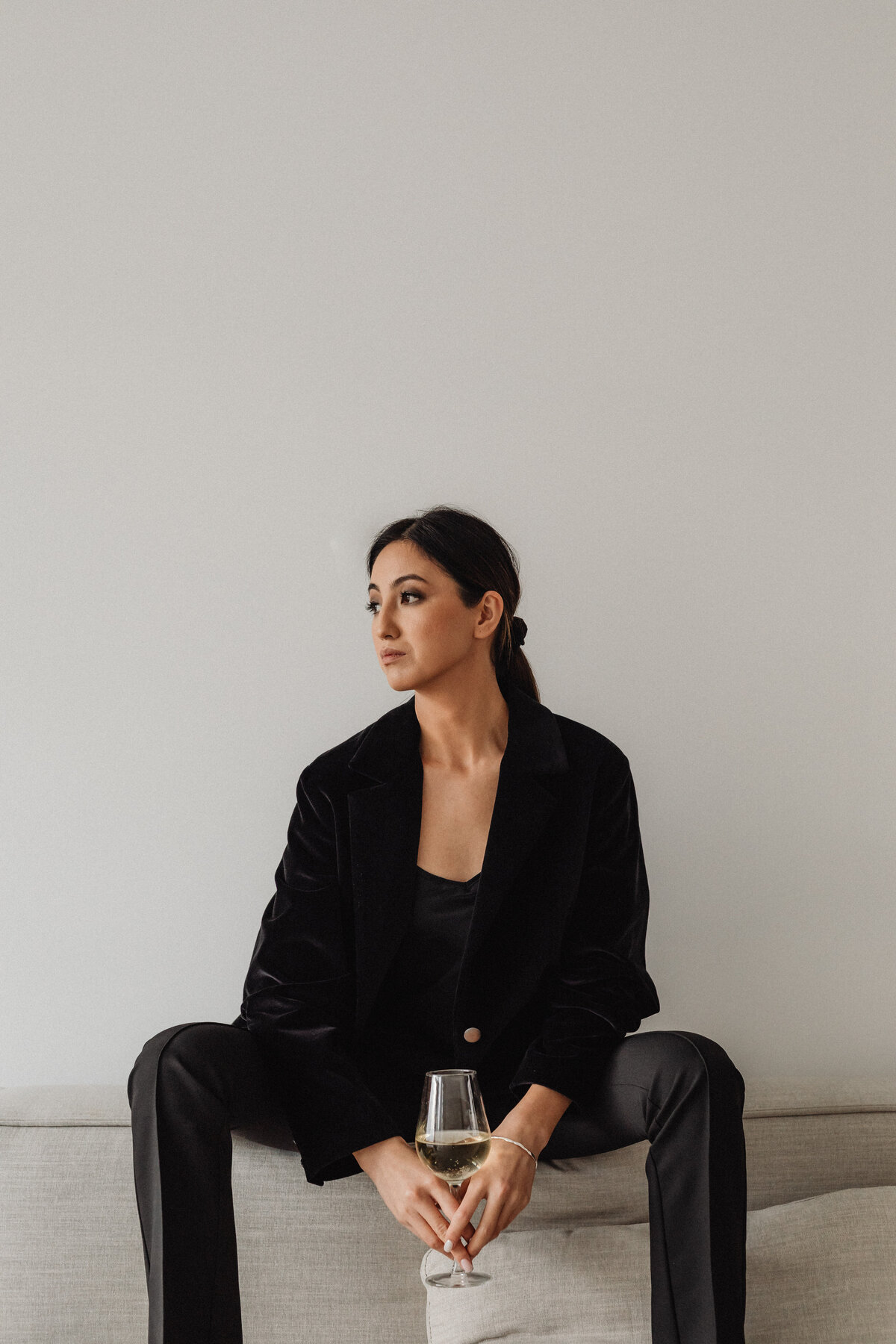 kaboompics_sophisticated-wine-tasting-portraits-modern-asian-woman-in-elegant-black-outfit-holding-white-wine-glass-33695