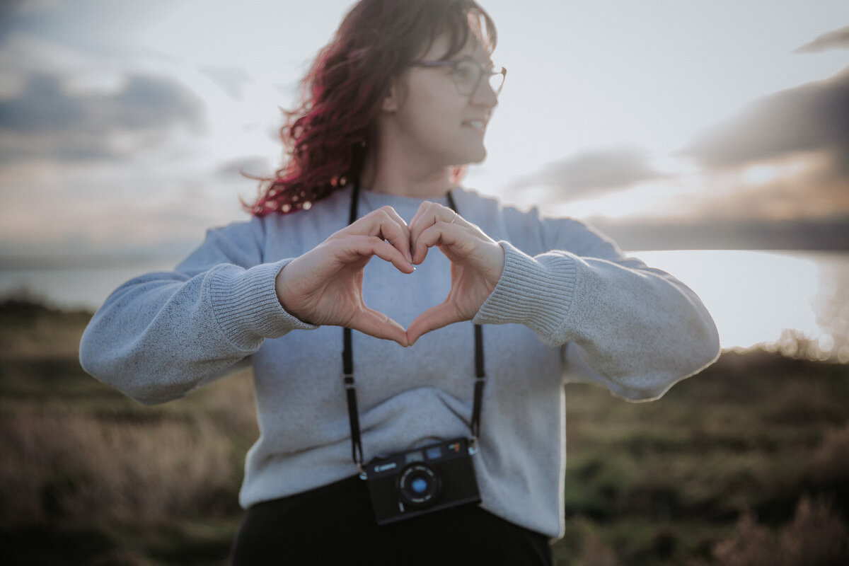a photographer taking a picture of a wedding couple
