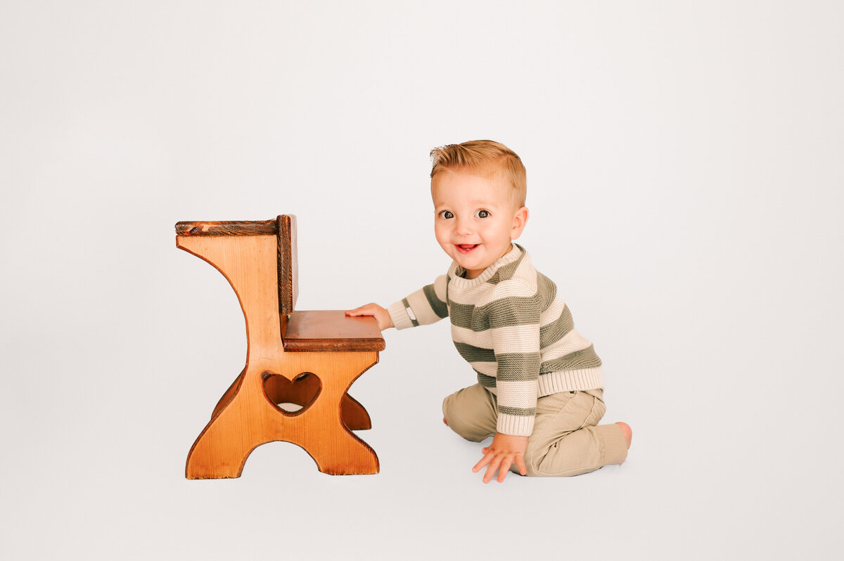 Springfield MO kids photographer of baby boy smiling in photography studio