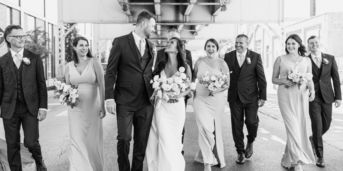 timeless chicago wedding photo of wedding party walking downtown