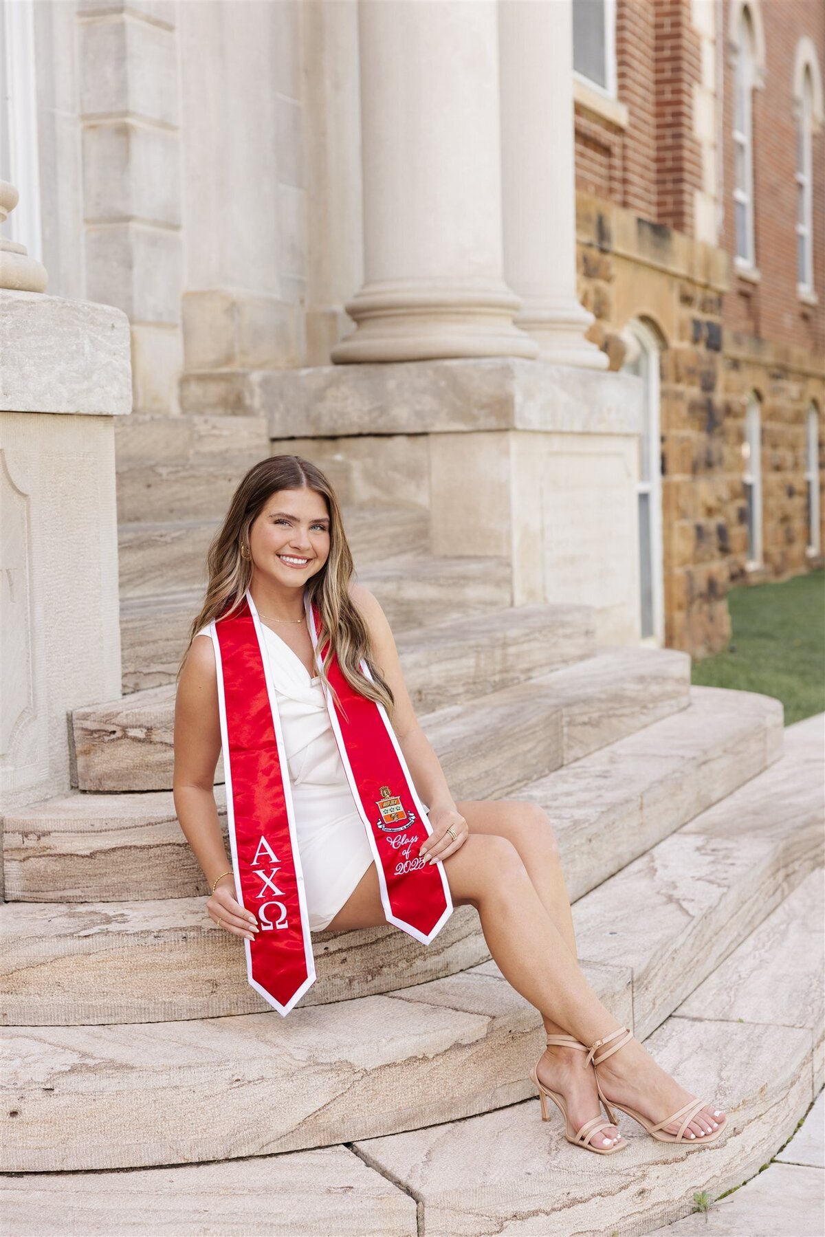 graduate on stairs portrait outdoor natural light spring style