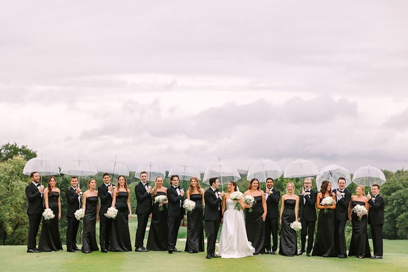 bride-and-groom-rainy-umbrella-evansville-country-club14