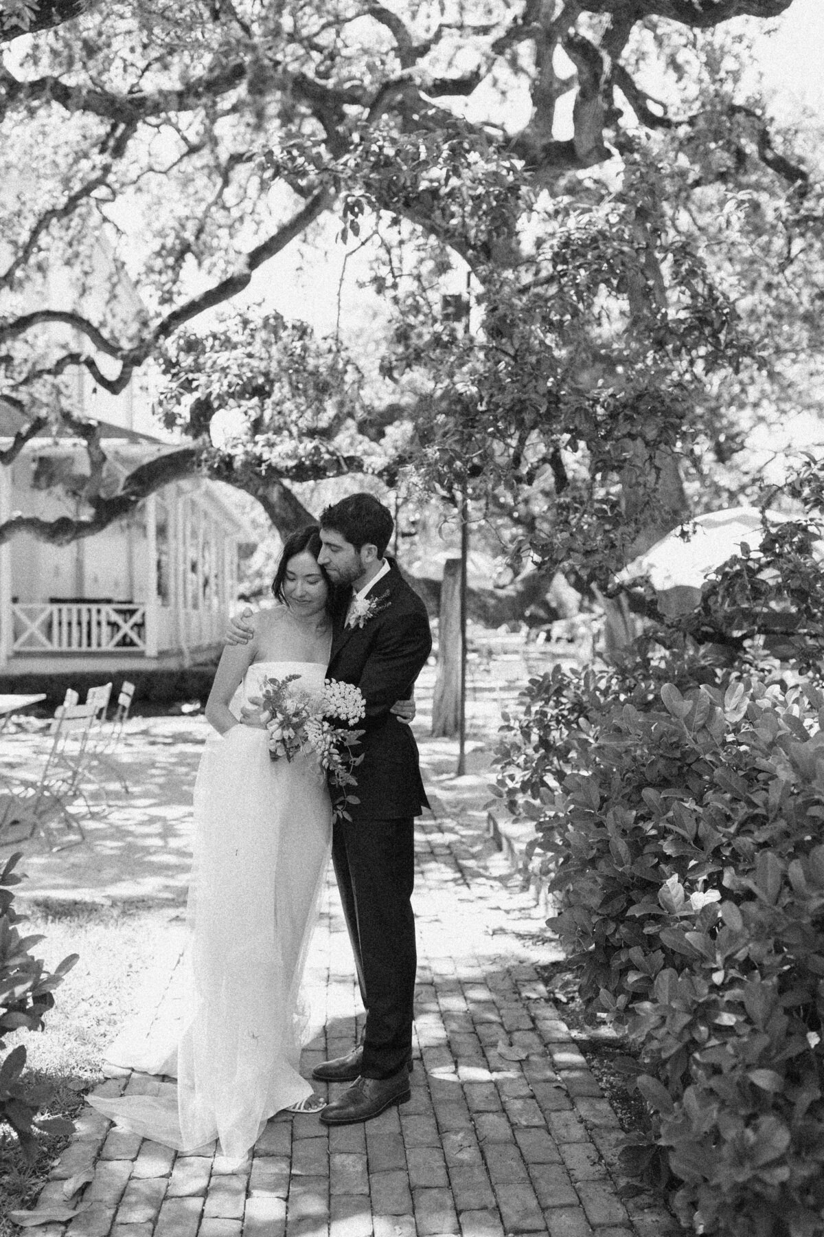 Bride and groom in the grounds of Mattie's  Austin Wedding