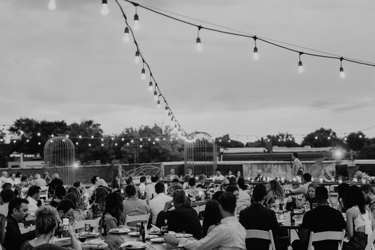 Black and white image of outdoor wedding reception