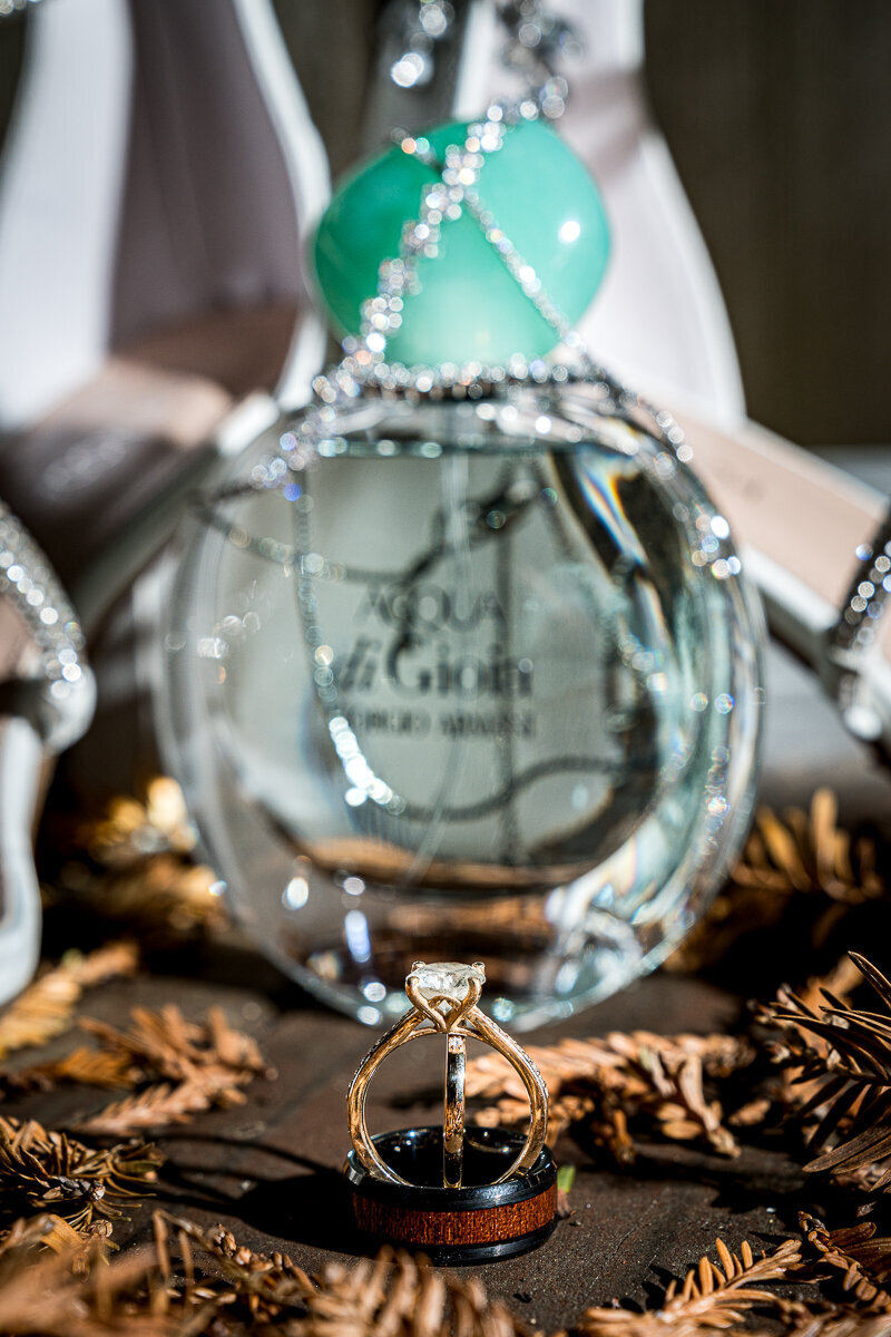 A beautifully styled flat lay of the bride’s details in Fortuna, CA, featuring delicate jewelry, elegant shoes, and a stunning bouquet, capturing the essence of her wedding day.