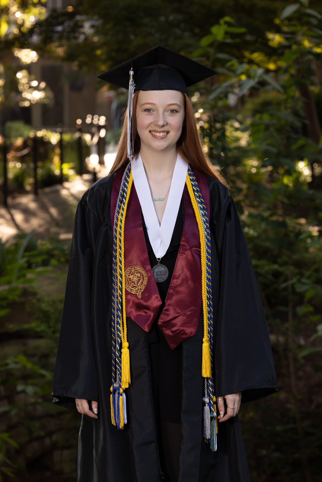 senior-girl-in-cap-and-gown-grapevine-botanical-gardens