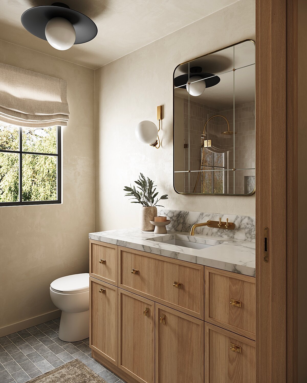 Organic modern bathroom design with custom white oak vanity, marble countertop, wall-mounted brass faucet, and grid-style mirror. Features plaster walls, linen roman shade, and natural light—ideal for timeless, California-inspired interiors.