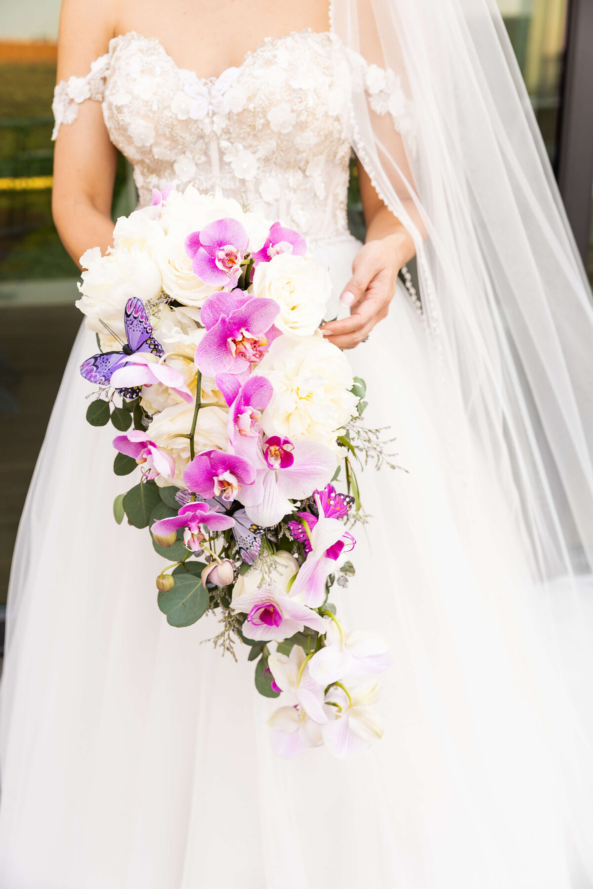 Bride holding bouquet of flowers at The Aertson hotel, Nashville