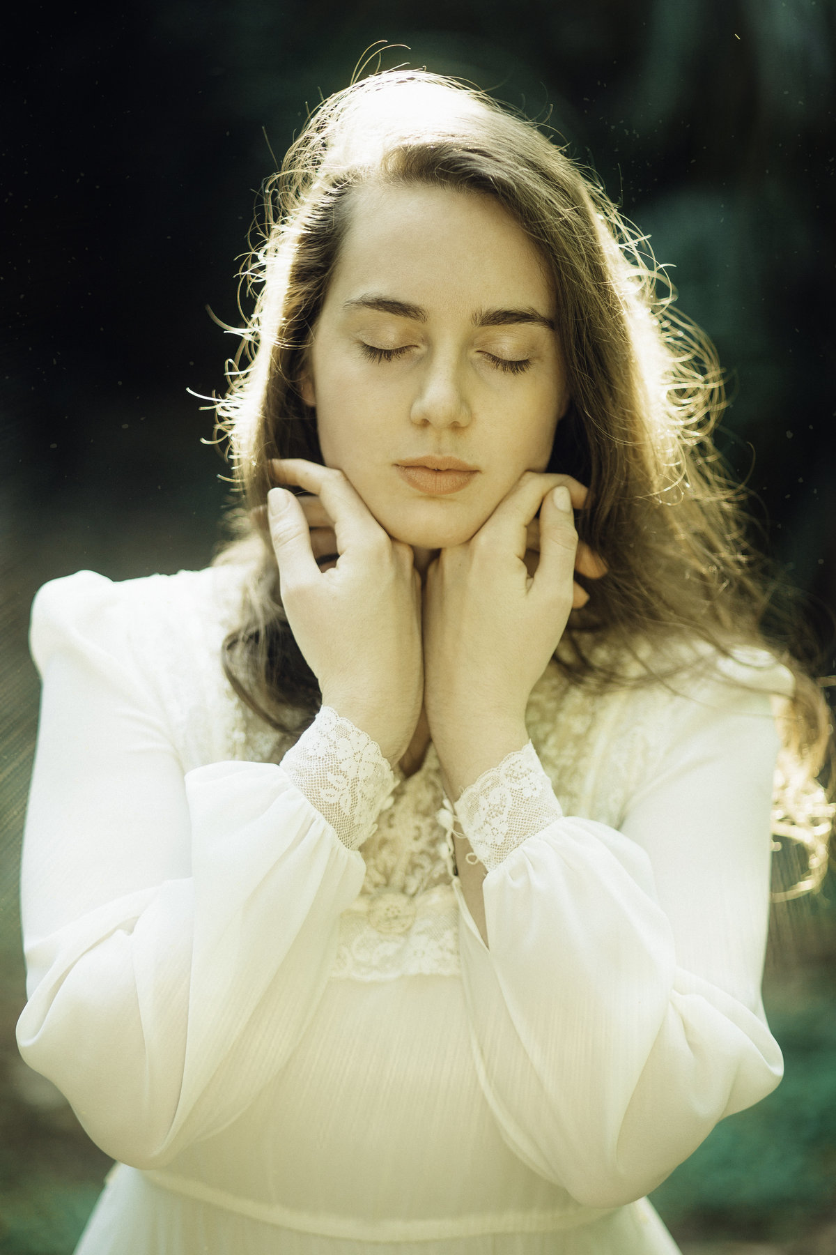 Portrait Photo Of Young Woman In White Dress With Her Eyes Closed Los Angeles
