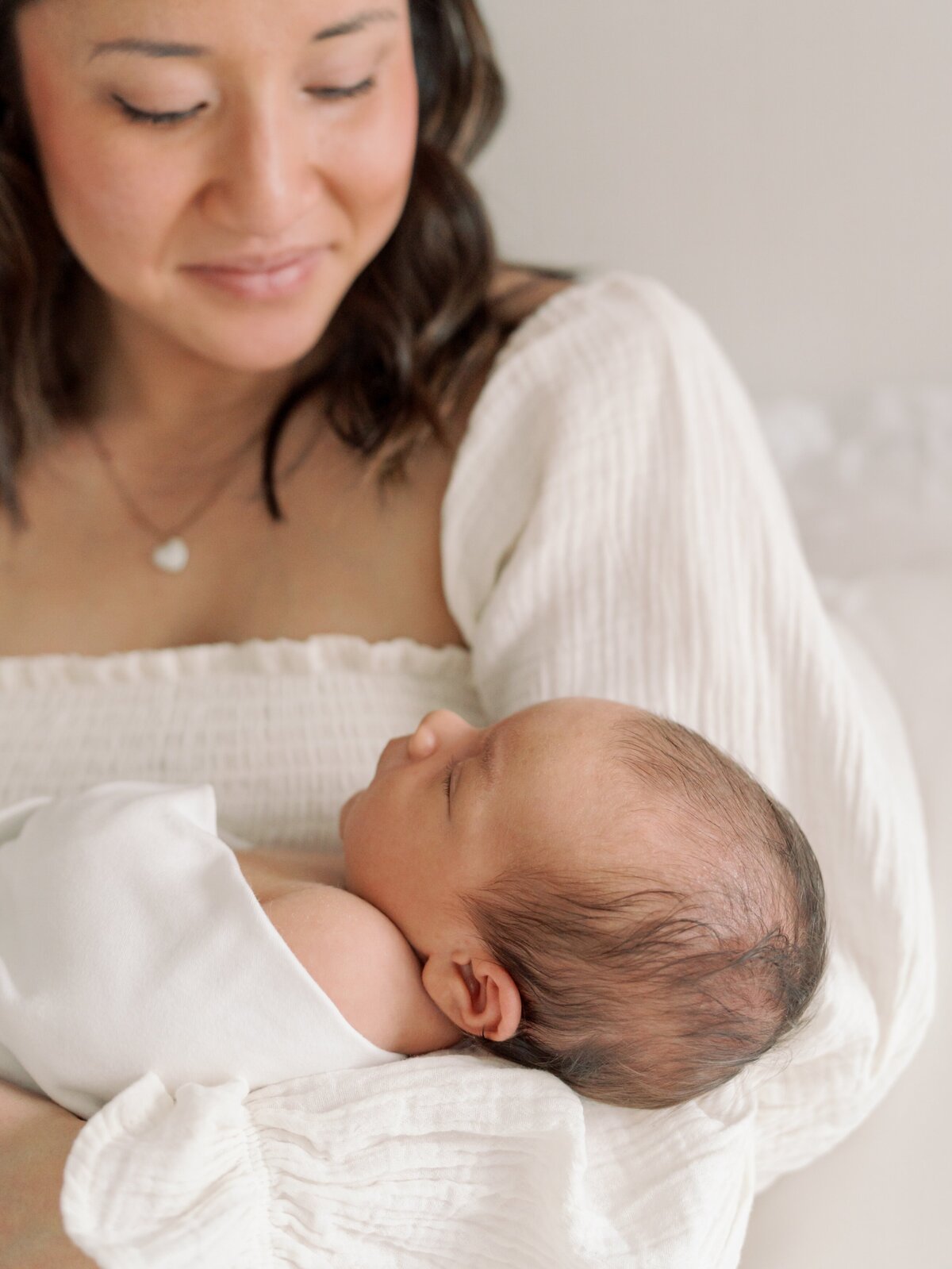 mom and son in home newborn photographer